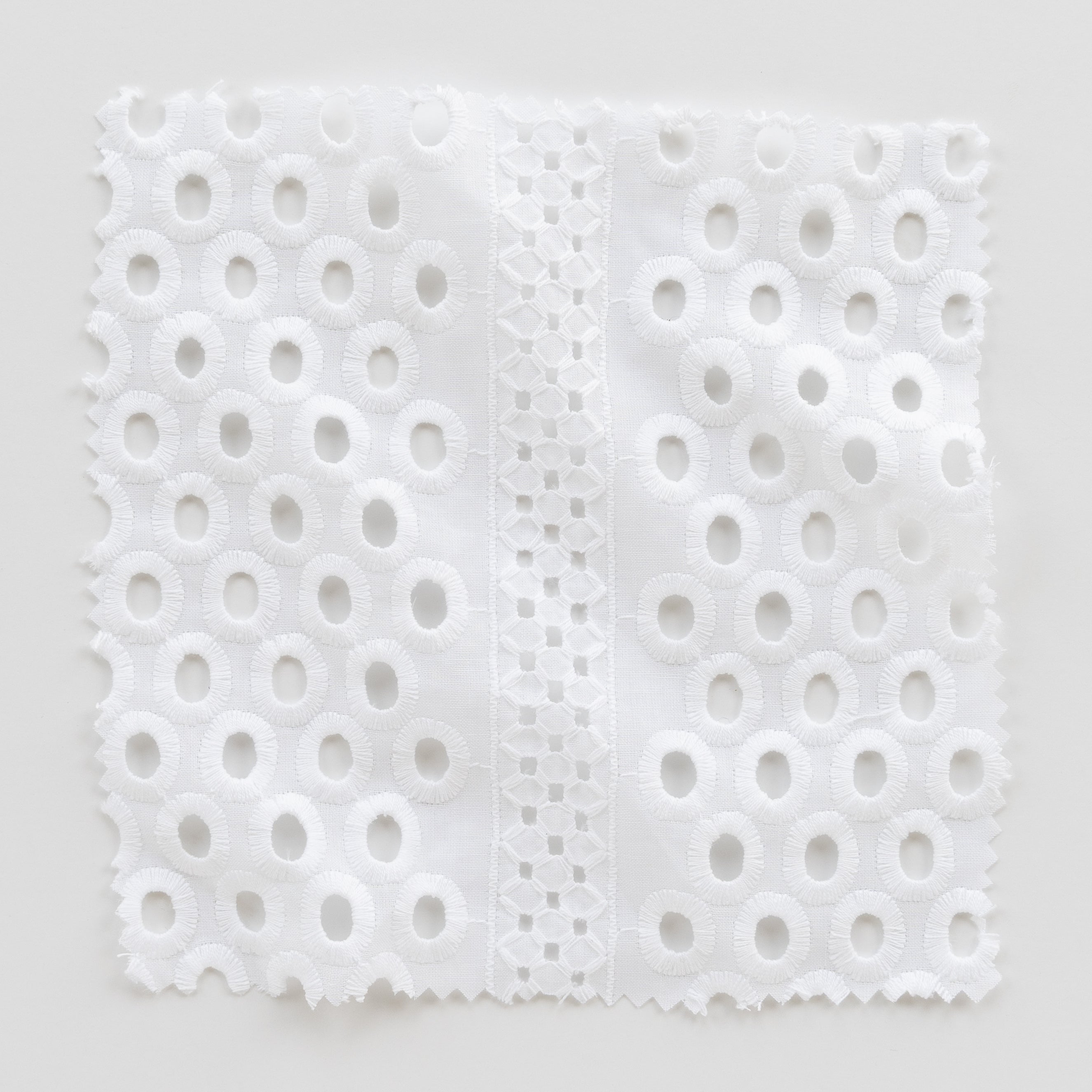 white cotton circles and diamonds Fabric Swatch